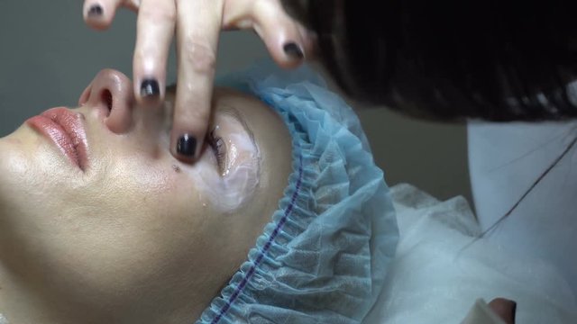 Young woman getting treatment in beauty saloon