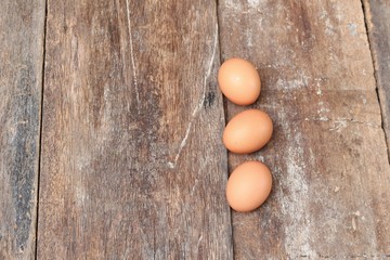  egg on wood background. Top view