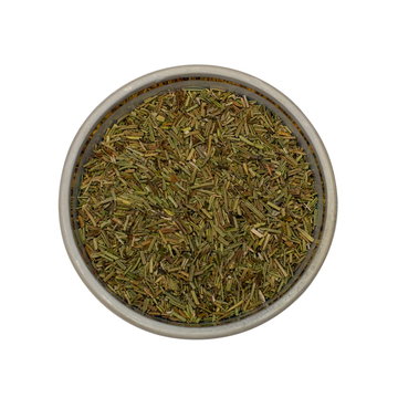 Rosemary spices. Dried leaves in a small dish isolated on a white background.