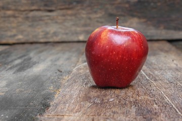 Red Apple on wooden table  background