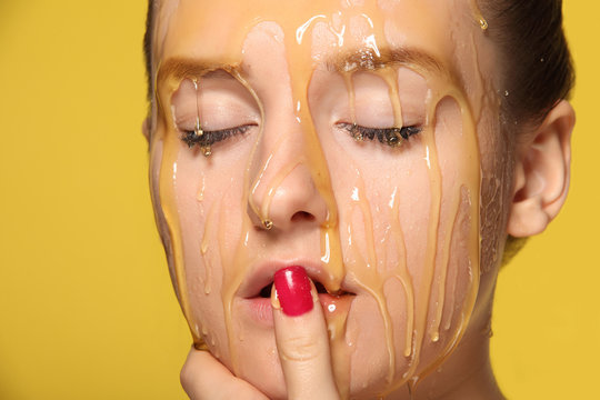 Beautiful Woman With Honey On Her Face