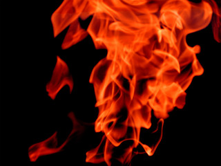 Bright flaming fire on black background