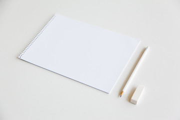 Blank sheet and pencil on white background. Template for design presentations. Branding Mock-Up.