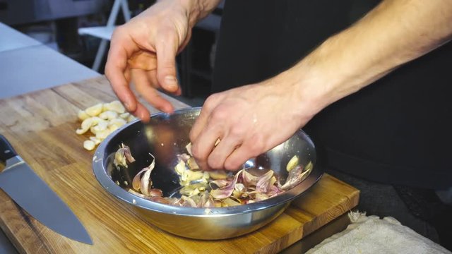 
cleaning the garlic for cooking. Garlic for French soup. Vegetarian food
