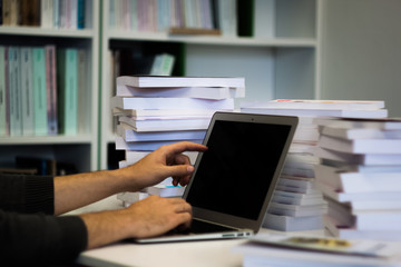 Guy or man or student or businessman work on a laptop computer i