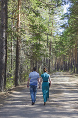 Obraz premium Couple in love walking in the woods.