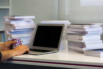 Guy or man or student or businessman work on a laptop computer i