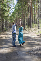 Obraz premium Couple in love walking in the woods.