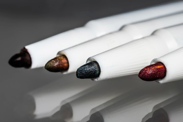 Color four pen close on a gray background