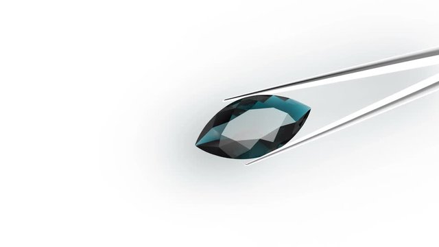 Blue diamond in tweezers