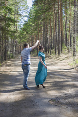 Couple in love walking in the woods.