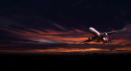 Airplane in the sky at sunrise