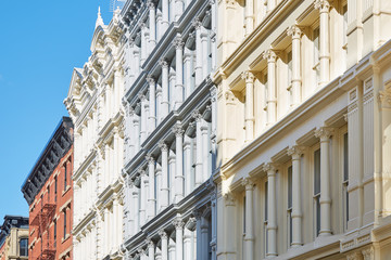 Ancient houses facades in New York, sunny day and blue sky, Soho