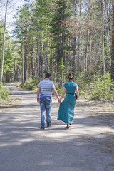 Couple in love walking in the woods.