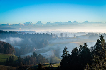 Swiss Alps over the fog