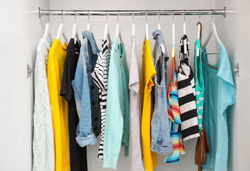 Collection of clothes hanging on a rack