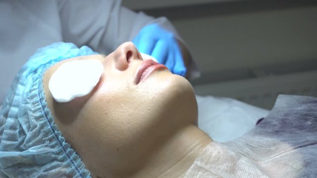 Young woman getting treatment in beauty saloon