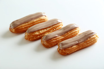 Eclairs with glaze isolated on a white