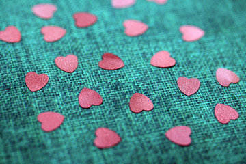 Macro Glitter Hearts on Fabric Background for Valentine 