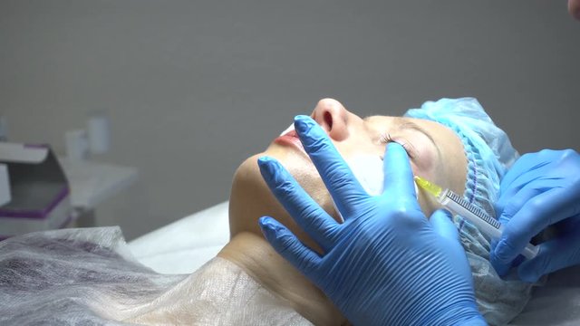 Young woman getting treatment in beauty saloon