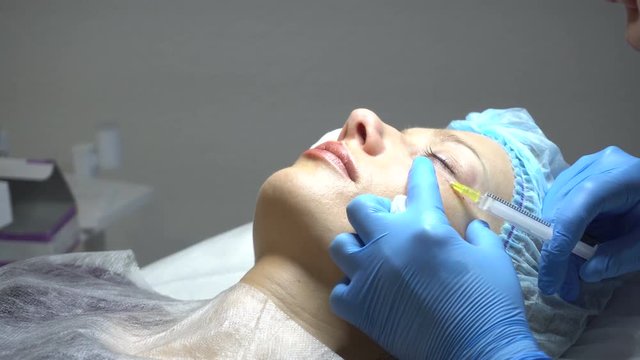 Young woman getting treatment in beauty saloon