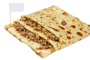 Pancake stuffed by meat white background view