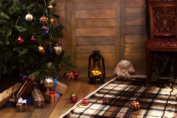christmas gift and objects under fir tree