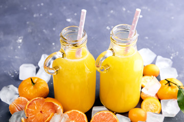 Bottle of Freshly squeezed citrus juice Fruit slice Ice