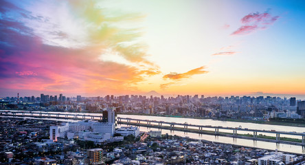 Fototapeta na wymiar Business and culture concept - panoramic modern city skyline bird eye aerial view with Mountain Fuji under dramatic sunset glow and beautiful cloudy sky in Tokyo, Japan
