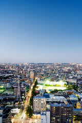 Fototapeta na wymiar Business and culture concept for real estate and corporate construction - panoramic modern city skyline bird eye aerial night view under dramatic neon glow and beautiful dark blue sky in Tokyo, Japan