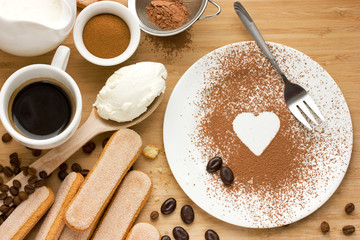 Ingredients for tiramisu on a wooden table