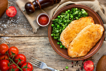 Chicken schnitzel with or cordon bleu with green salad and cherry