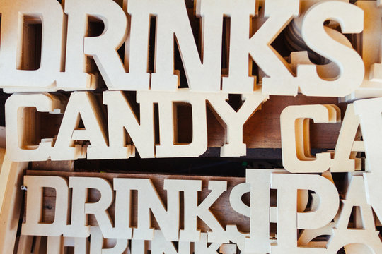 Close-up stack of words made out of wood