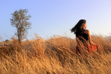 Sunset with young woman religion