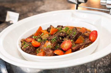 Roast mutton with pumpkin and tomato