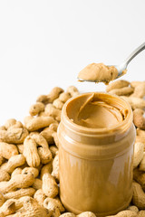 Creamy peanut butter and spoon isolated on white background
