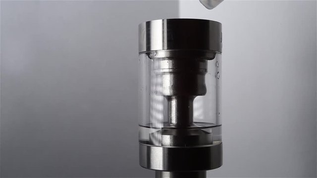 Filling of a tank for an electronic cigarette liquid close up. Rebuildable dripping atomizer (RDA). Electronic nicotine delivery systems. ENDS.