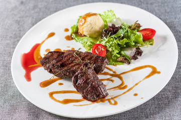Steak with mashed potatoes and salad