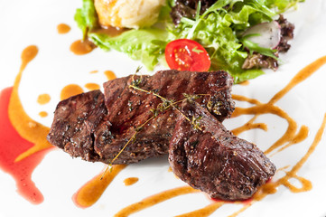 Steak with mashed potatoes and salad