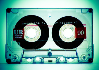 Old audio cassette with tape. Photo closeup.
