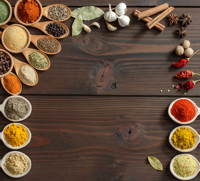 Colorful spices decoration on wooden table - Top view