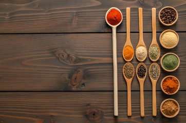 Indian spices and herbs on wooden table - Top view