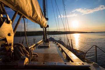 Fototapeta na wymiar sunset at sea on aboard Yacht Sailing