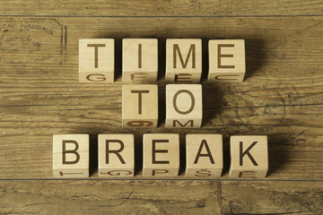 time to break text on a wooden cubes