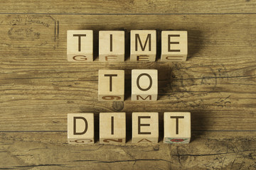 time to diet text on cubes on wooden background