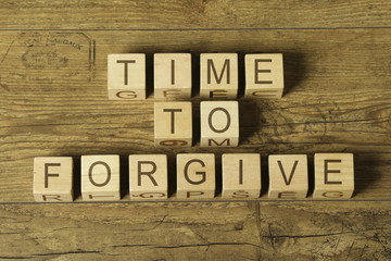 Time to forgive text on wooden toy cubes