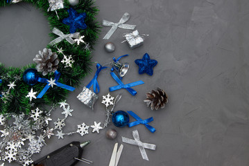 Making Christmas wreaths. Instruments, materials, adhesive.
