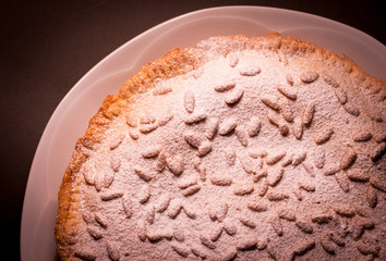 Italian cake covered with pine nuts known as 'torta della nonna'