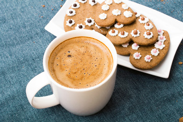 Cup of coffee and heart shaped cookies