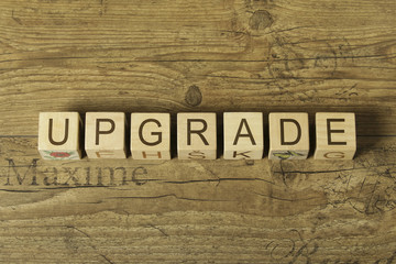 upgrade word on wooden background